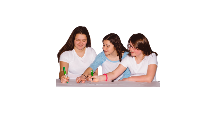 Three young people at a desk working together.