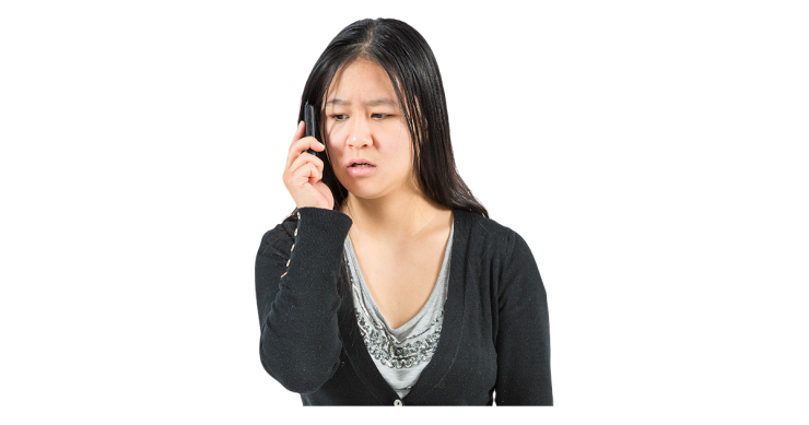 Woman looking upset while talking on the phone.