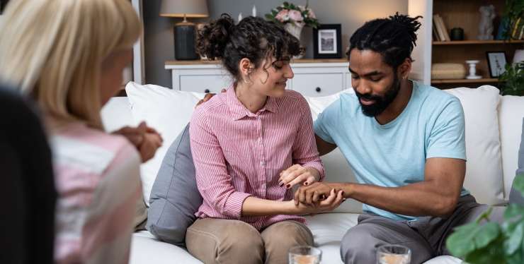 Couple sitting on a sofa in couples counselling