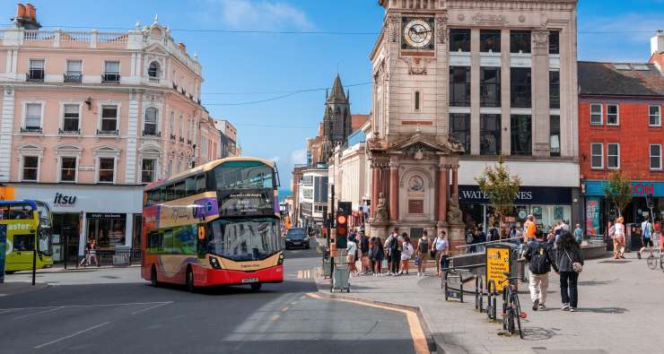 Brighton clock tower with a Brighton bus and shoppers
