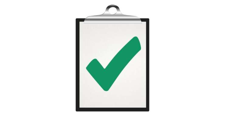 Green tick on a clipboard.