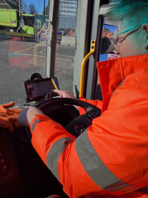Driver checking off an in-cab tablet.