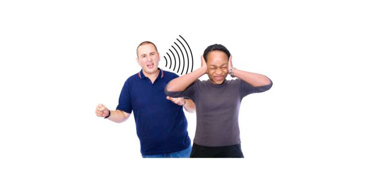 Two people, one gesturing energetically, the other covering their ears.
