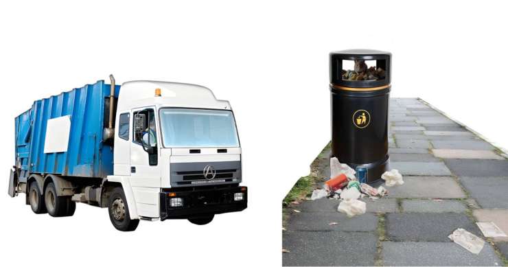 A large white rubbish truck with a blue waste container attached at the back next to an overflowing bin with litter scattered around it on a pavement.