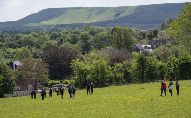 People walking in the countryside.
