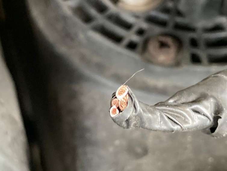 image showing the wires on a lorry that have been cut