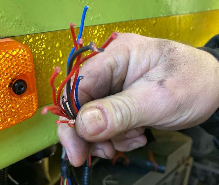 image showing the wires on a lorry that have been cut