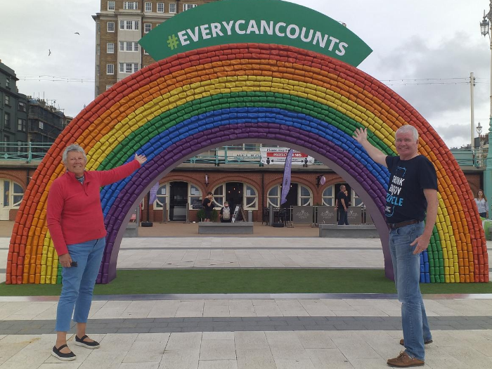 Councillor Sue Shanks, joint deputy leader of the council, and Rick Hindley, Director of Every Can Counts, in front of the recycled can rainbow arch.